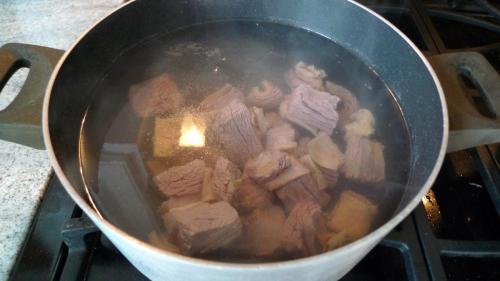 place meat pieces into hot water